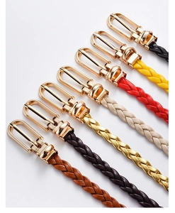 Detailed close-up of colorful braided belts with gold-tone U-shaped buckles