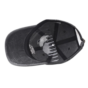 Detailed interior of a washed grey baseball cap with cotton fabric and adjustable metal buckle