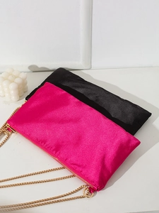 Elegant satin tote bags in rose red and black featuring stylish gold chain straps