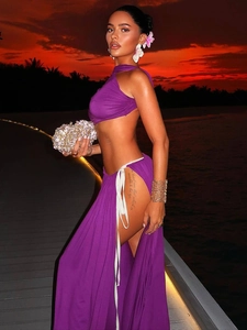 Elegant purple two-piece vacation set featuring a halter crop top and high slit maxi skirt