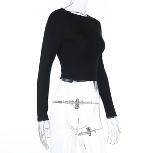 Detail of black long sleeve crop top showing the slim fit and soft ribbed texture