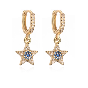 Gold star earrings with blue zircon center and white pavé stones on white background
