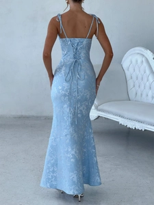 Detail of light blue jacquard evening dress featuring lace-up back and mermaid hemline