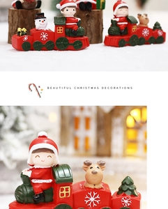 Detailed macro view of resin Christmas train miniatures with Santa and snowman figurines