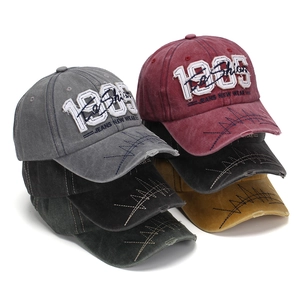 Vintage washed cotton baseball caps with 1985 embroidery in multiple retro colors