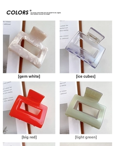 Detailed grid of rectangular acetate hair claws in white, blue, red and green colors