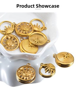 Macro detail of gold sun charms with smiley face and sunburst patterns for DIY jewelry