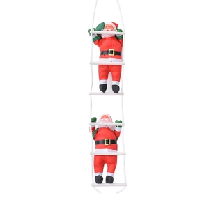 Christmas decoration featuring two Santa Claus figures climbing a white rope ladder decor