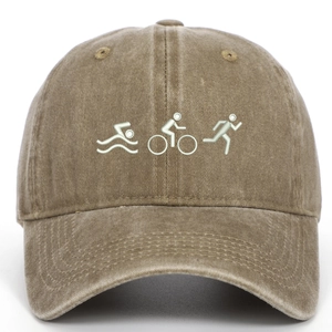 Close-up of triathlon embroidery on brown washed cotton vintage baseball cap with curved brim