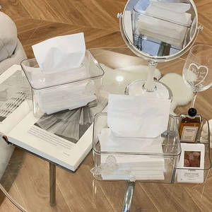 Close-up of clear acrylic tissue box with butterfly decor and side storage compartments