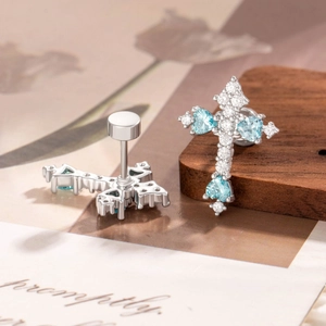 Minimalist silver cross cartilage studs with sea blue zircon and screw-back closure