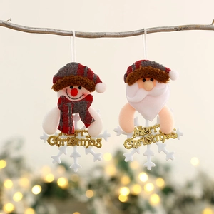 Christmas tree ornaments with snowman and Santa Claus featuring gold Merry Christmas text