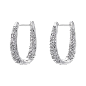 Close-up of silver-tone oval hoop earrings with pavé set white cubic zirconia stones