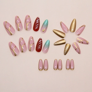 Macro view of almond press-on nails featuring starfish and gold leaf ripple textures