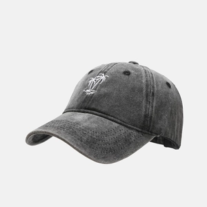 Close-up of vintage washed grey cotton baseball cap with white palm tree embroidery detail