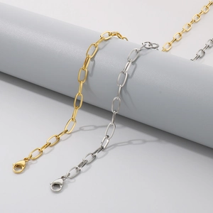 Detail of gold and silver stainless steel oval link chains with secure lobster clasps
