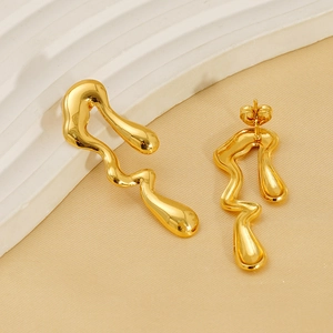 Macro detail of 18k gold plated irregular wave studs with a glossy liquid metal finish