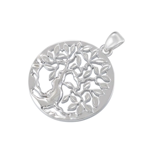 Macro shot of silver tree of life pendant with hollow design and smooth metal texture