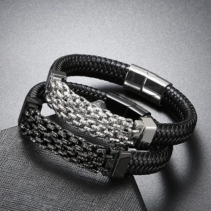 Detailed view of punk leather bracelets with hammered metal and sparkling rhinestones
