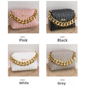 Collage of quilted square bags in pink, black, white and grey with gold chain straps