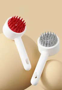 Detail view of red and grey silicone scalp massager brushes with ergonomic ABS handles