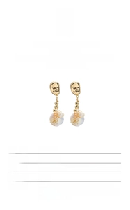 Detailed view of baroque freshwater pearl earrings with 18k gold plated S925 silver finish