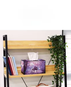 Detail of DIY diamond painting tissue box featuring a purple forest and piano landscape