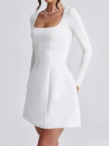 Detail shot of a white long-sleeve mini dress with a square neckline and slim fit cut