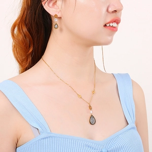 Elegant gold leaf jewelry set with teardrop zircon pendant necklace and earrings