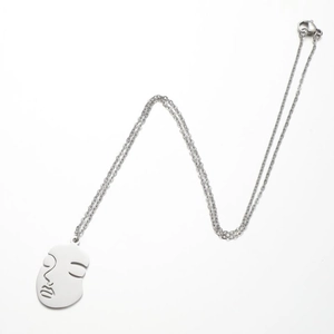 Abstract face pendant necklace in silver stainless steel with minimalist line art style