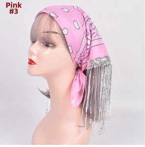 Detail of pink paisley bandana featuring shimmering silver sequin fringe and silk-like fabric