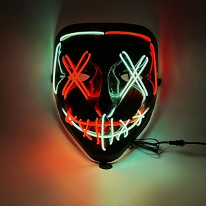 Macro shot of LED party mask with glowing red and green EL wire stitching and wire connector