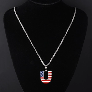Detail of silver Cuban chain with U-shaped American flag pendant on a black bust