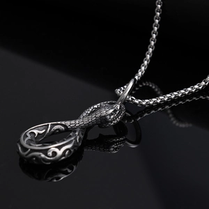 Vintage punk silver snake pendant necklace featuring an infinity 8 design on black surface