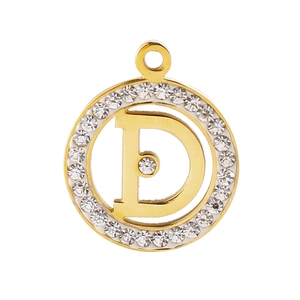 Macro detail of gold-plated pendant featuring letter D design with sparkling crystal border