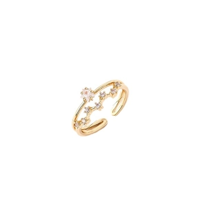 Minimalist gold adjustable ring with star design and crystal accents on white background