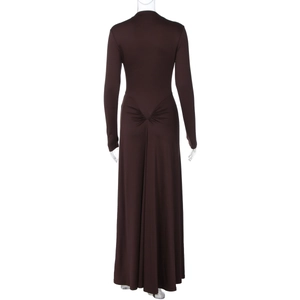 Detail of the back of a slim-fit coffee brown maxi dress with ruched waist and long sleeves