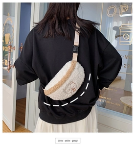 Detail of white sherpa waist bag with cute brown bear embroidery and adjustable strap