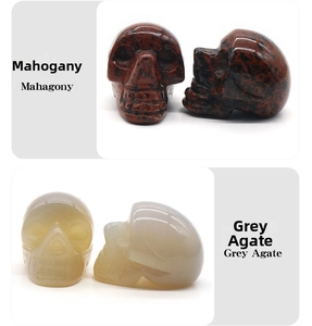 Detailed front and side views of Mahogany Obsidian and Grey Agate crystal skull carvings