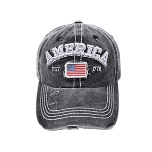 Close-up of AMERICA embroidery and USA flag patch on vintage washed baseball cap