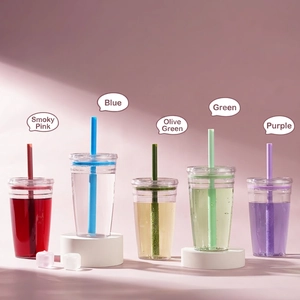 Five colorful 450ml Tritan straw tumblers for coffee and tea on pink background