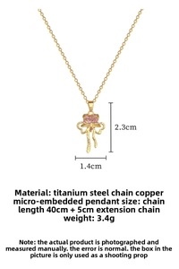 Detail of pink heart gem pendant with bow design showing 2.3cm by 1.4cm dimensions