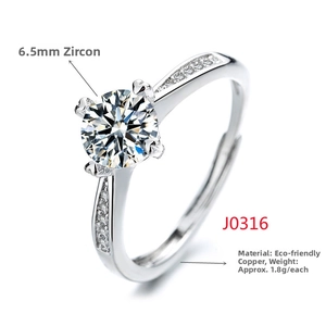 Close-up of silver-tone ring with 6.5mm round zircon in classic four-prong setting