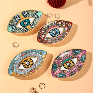 Set of four ceramic Evil Eye jewelry trays with gold trim for home decoration