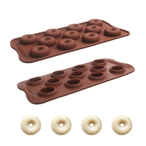Detailed view of 15-cavity silicone chocolate mold with spiral flower pattern