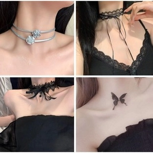 Detail view of four choker styles including lace ribbons and butterfly pendants
