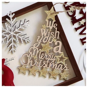 Detail of red flocked wooden Christmas sign with gold glitter stars and Merry Christmas text