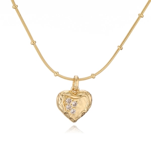 Detailed close-up of a gold lava textured heart pendant necklace with shimmering crystals