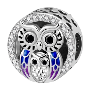 Detailed silver owl charm with blue enamel inlay and sparkling zircon stones