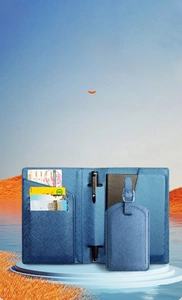 Detailed blue cross-pattern leather passport holder interior with pen loop and card slots